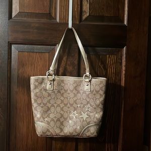 Coach signature tote zipper purse with stars.